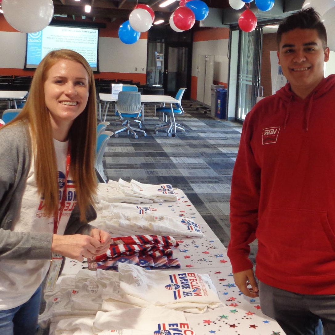 Tara Karaim, Community-Based Learning coordinator, and Abe S. participate in an election day party as part of the Crush the Vote initiative.